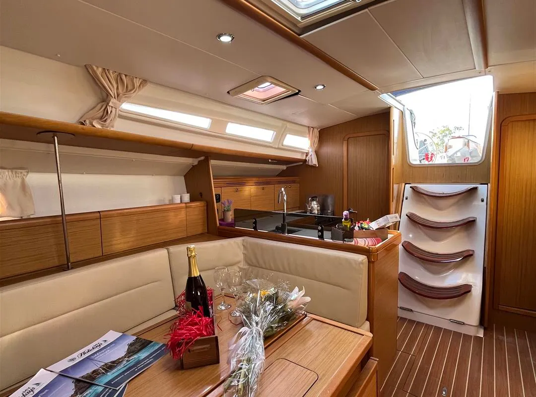 Salon of Waterproof, a Jeanneau Sun Odyssey 42 i sailboat at Lavreotiki Municipal Unit, Greece
