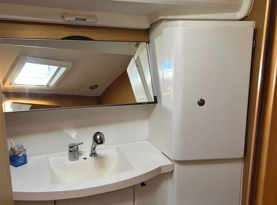 Head on Waterproof, a Jeanneau Sun Odyssey 42 i sailboat at Lavreotiki Municipal Unit, Greece
