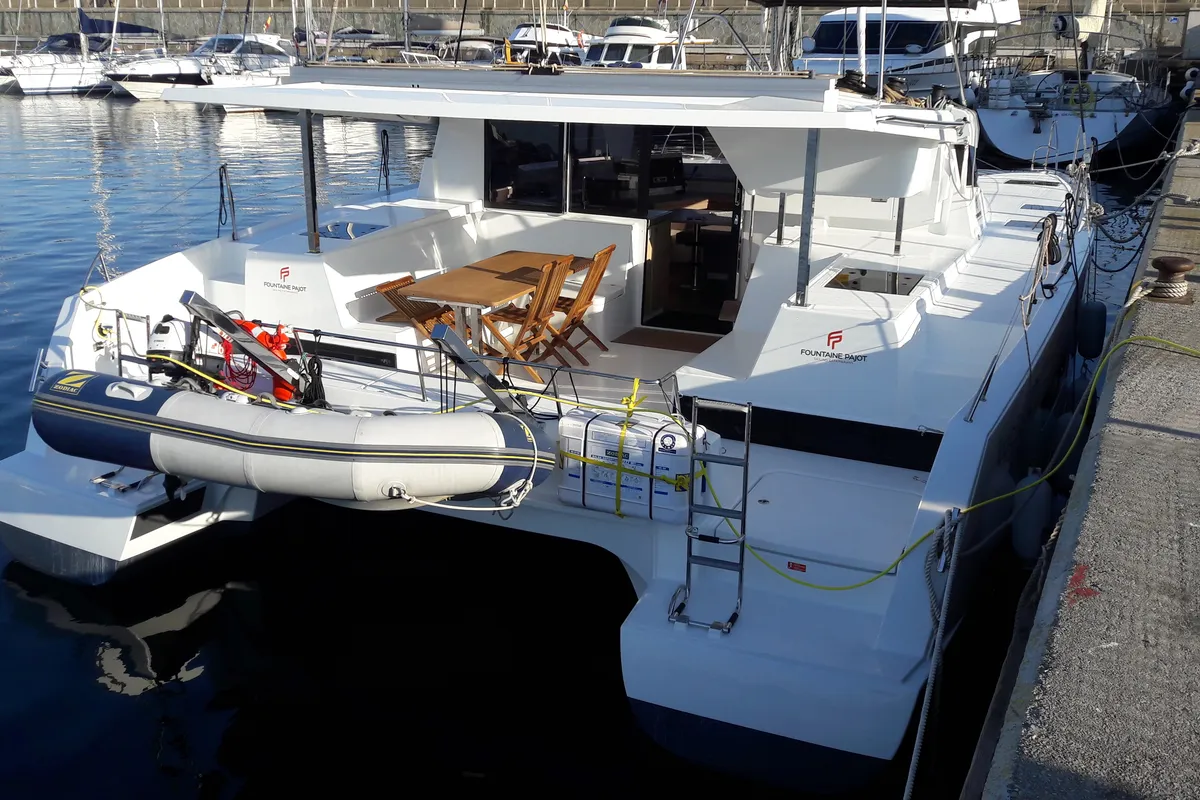 Exterior view of Ginesta, a Fountaine Pajot Lucia 40 catamaran at Palamós, Spain