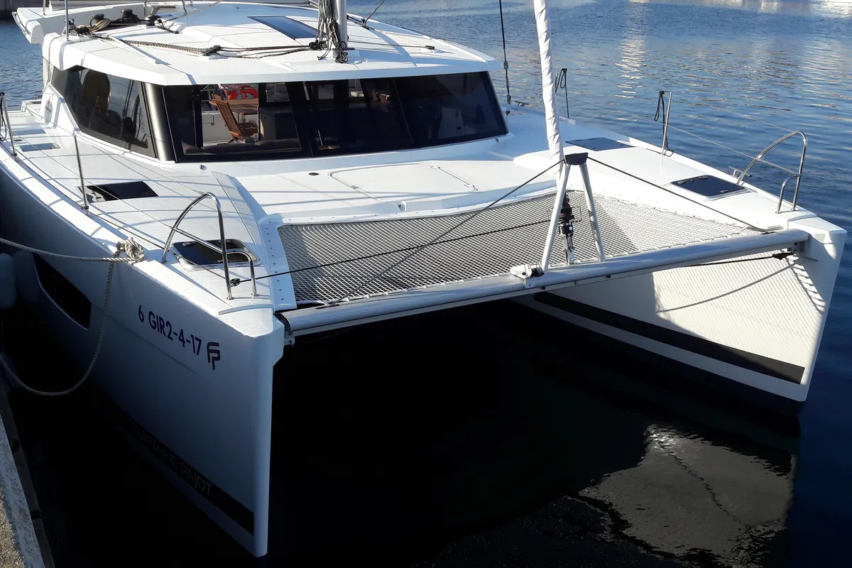 Exterior view of Ginesta, a Fountaine Pajot Lucia 40 catamaran at Palamós, Spain