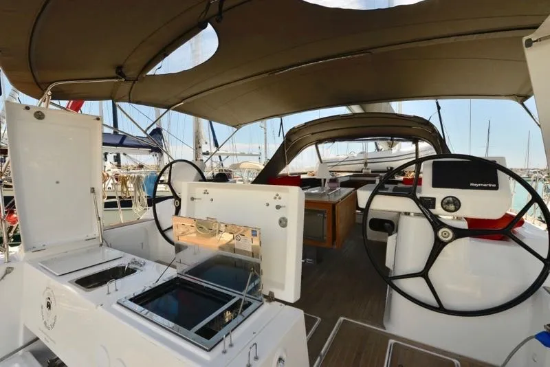 Cockpit of Santa Maria Novella, a Dufour 520 GL - 4. cab sailboat at Cecina, Italy