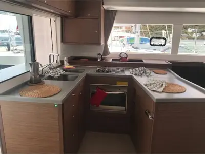 Paula, a Lagoon 450 Fly catamaran at Sant Antoni de Portmany, Spain