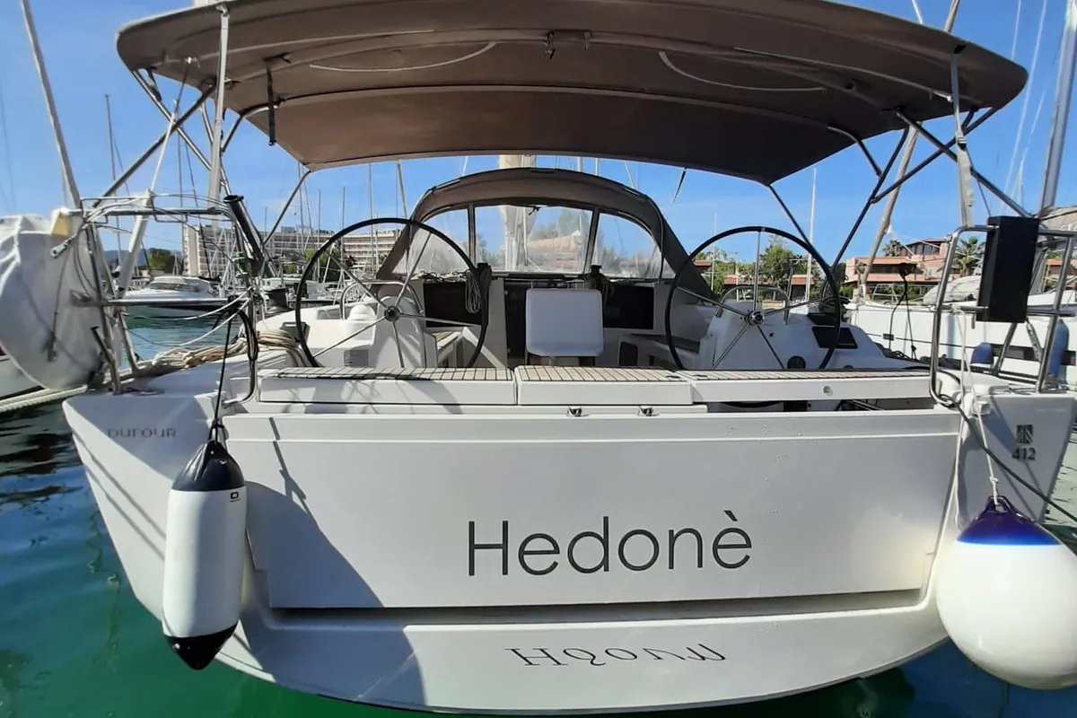 Exterior view of Hedoné, a Dufour 412 Grand large sailboat at Tonnarella, Italy
