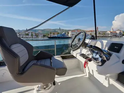 Cockpit of Merry Fisher 1095 Fly, a Jeanneau Merry Fisher 1095 Fly motorboat at Grad Trogir, Croatia