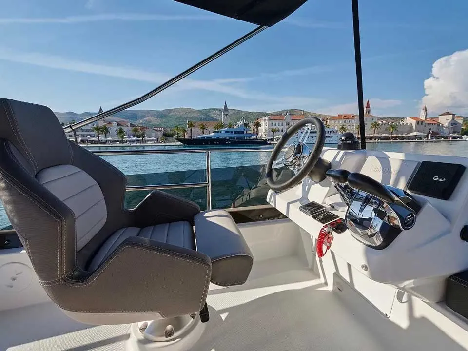 Cockpit of Merry Fisher 1095 Fly, a Jeanneau Merry Fisher 1095 Fly motorboat at Grad Trogir, Croatia