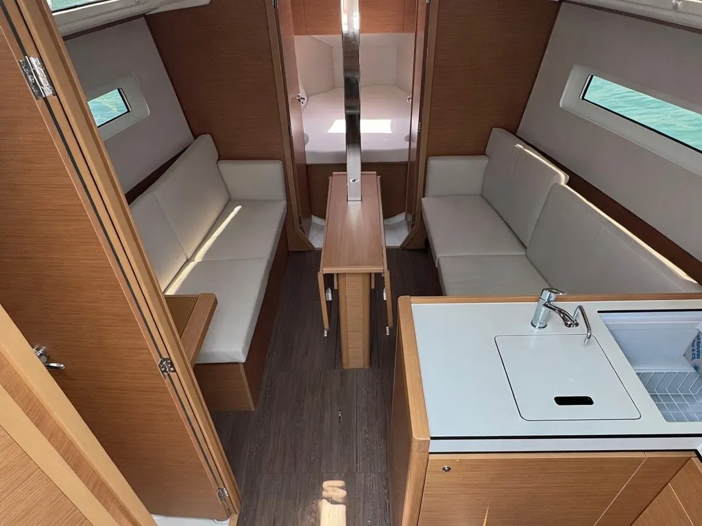Salon of All in, a Jeanneau Sun Odyssey 350 sailboat at Nettuno, Italy