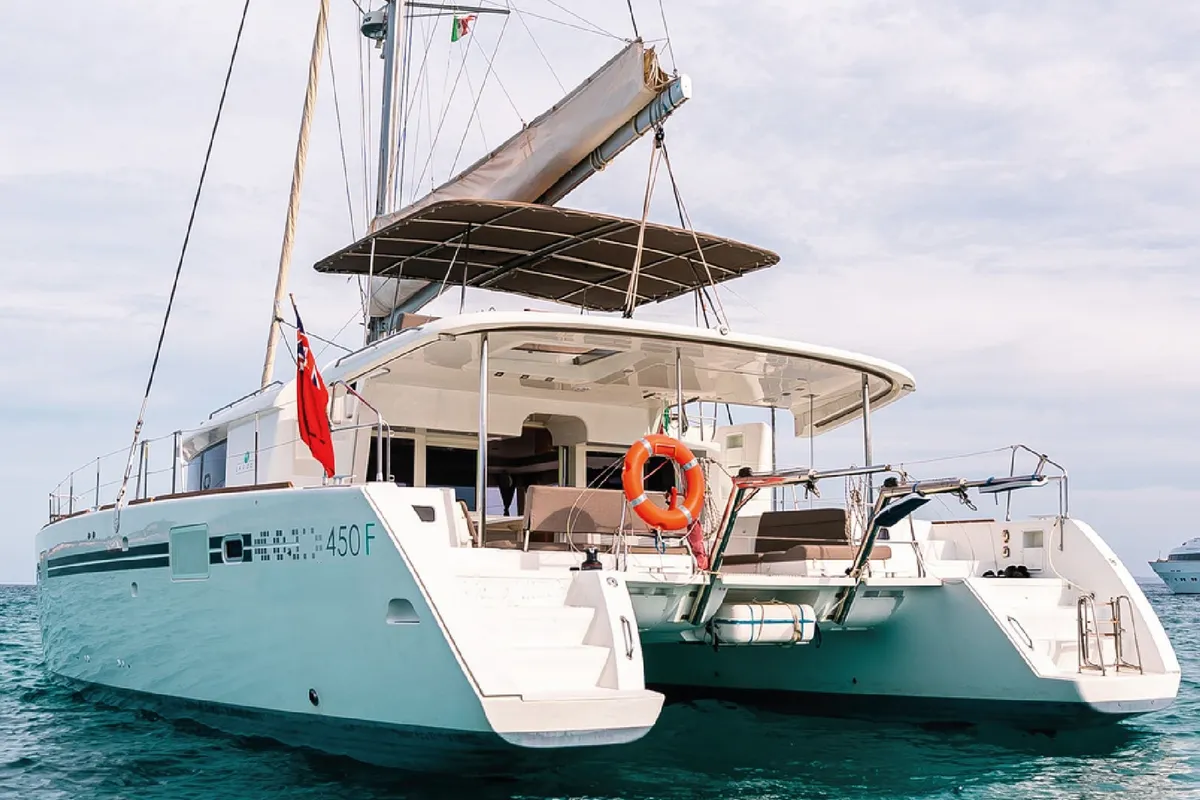 Exterior view of Lluna, a Lagoon 450 catamaran at Sant Antoni de Portmany, Spain