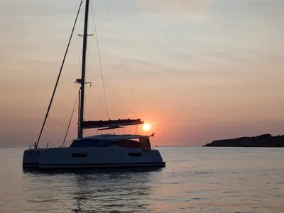 Libertad VII, a Fountaine Pajot Astréa 42 catamaran at Sant Antoni de Portmany, Spain