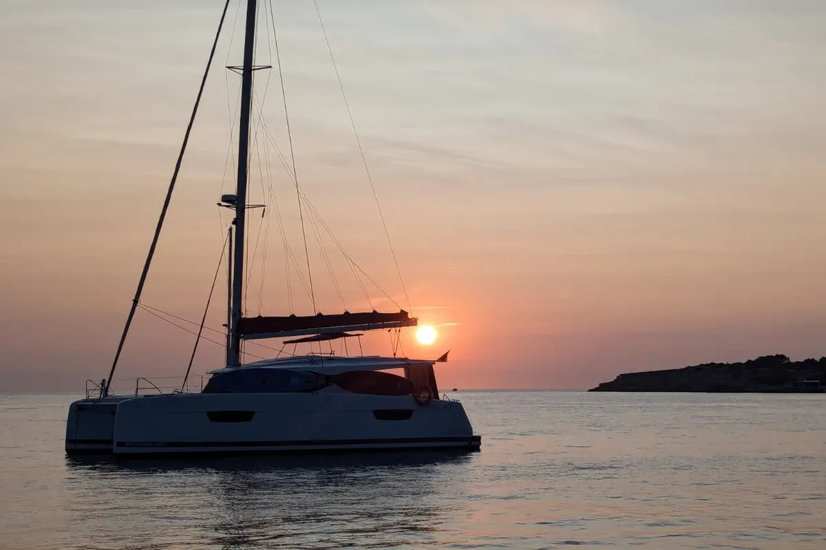 Libertad VII, a Fountaine Pajot Astréa 42 catamaran at Sant Antoni de Portmany, Spain