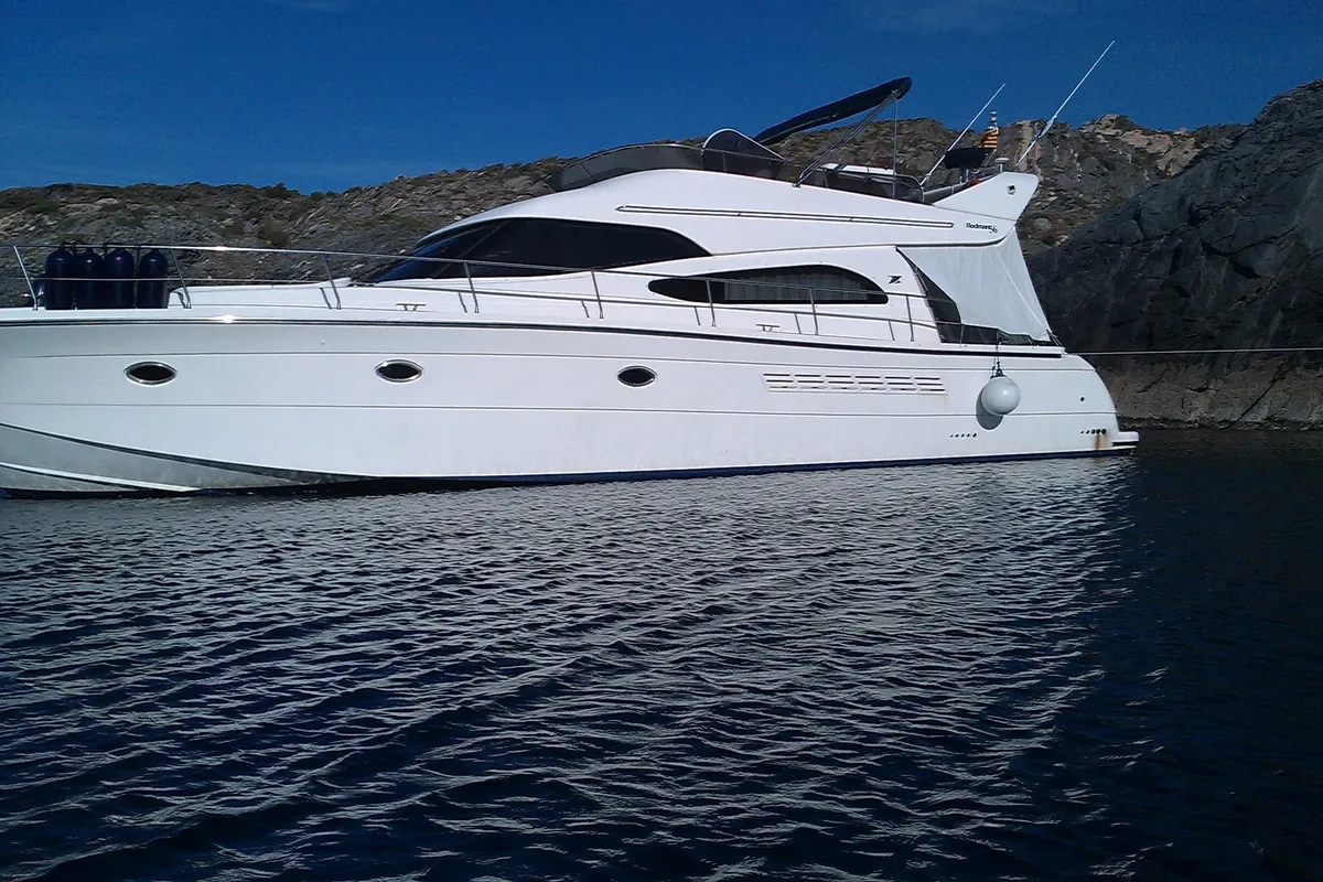 Exterior view of Port Ligat, a Rodman 56 Fly motor yacht at Port d'Andratx, Spain