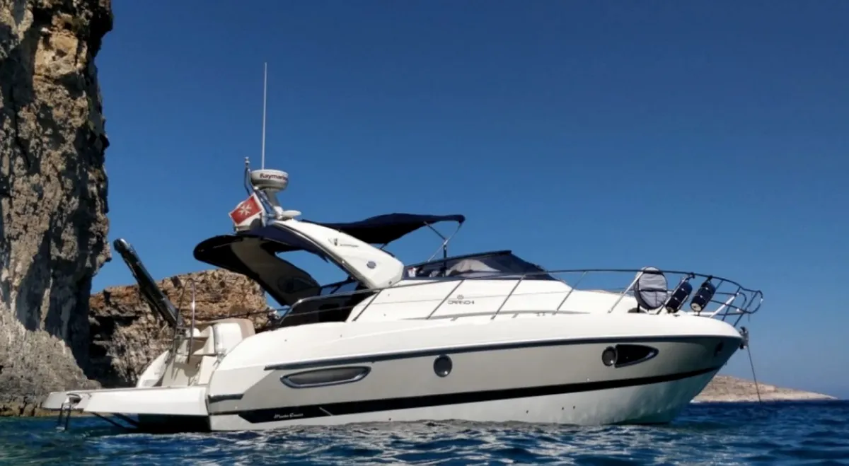 Exterior view of Tottoi, a Cranchi Zaffiro 36 motorboat at Cannigione, Italy