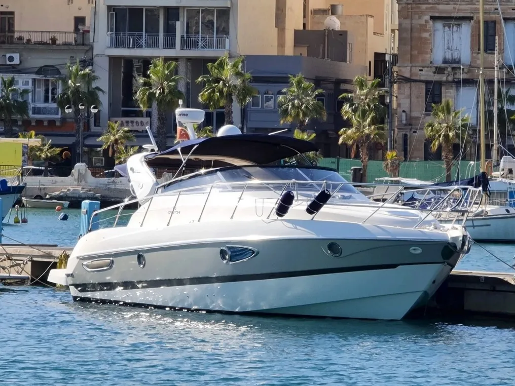 Exterior view of Tottoi, a Cranchi Zaffiro 36 motorboat at Cannigione, Italy