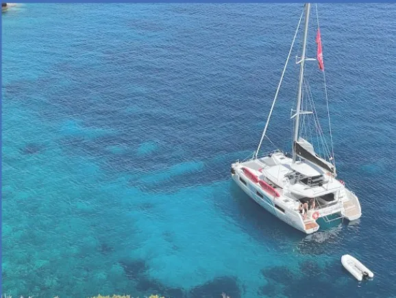 Exterior view of Blue Regeneration, a Lagoon 46 catamaran at Sant Antoni de Portmany, Spain