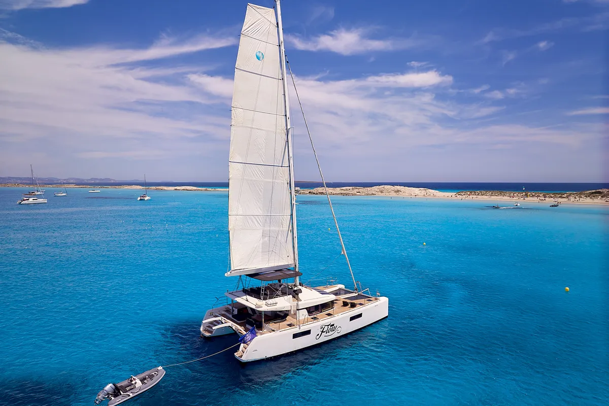 Exterior view of Flow, a Lagoon 52 catamaran at Sant Antoni de Portmany, Spain