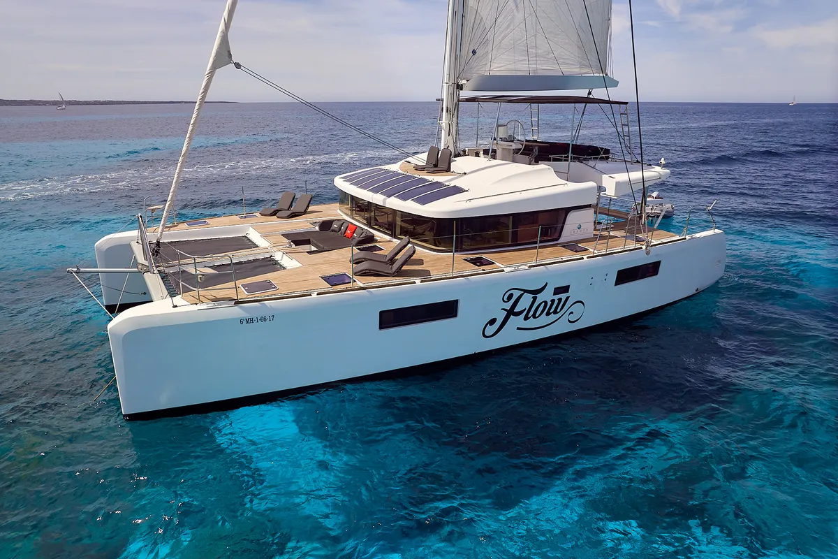 Exterior view of Flow, a Lagoon 52 catamaran at Sant Antoni de Portmany, Spain