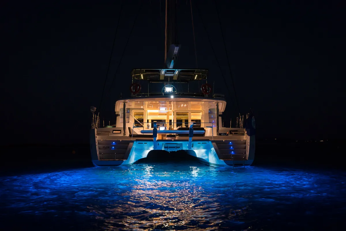 Exterior view of Flow, a Lagoon 52 catamaran at Sant Antoni de Portmany, Spain