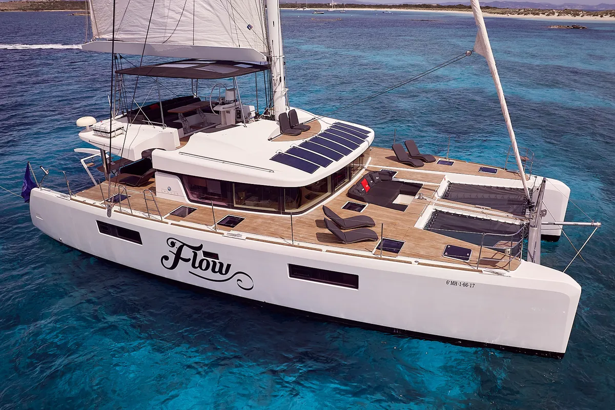 Exterior view of Flow, a Lagoon 52 catamaran at Sant Antoni de Portmany, Spain