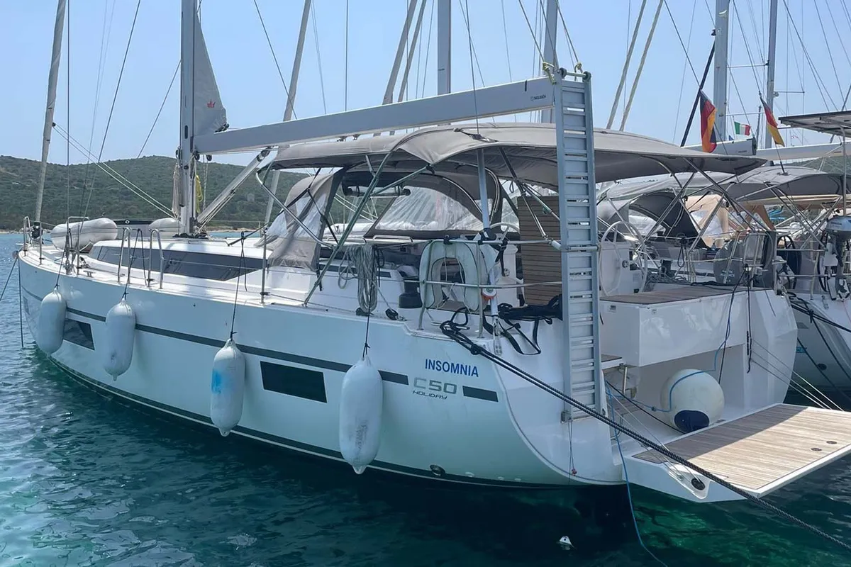 Exterior view of Insomnia, a Bavaria C50 Holiday sailboat at Figari/Golfo Aranci, Italy