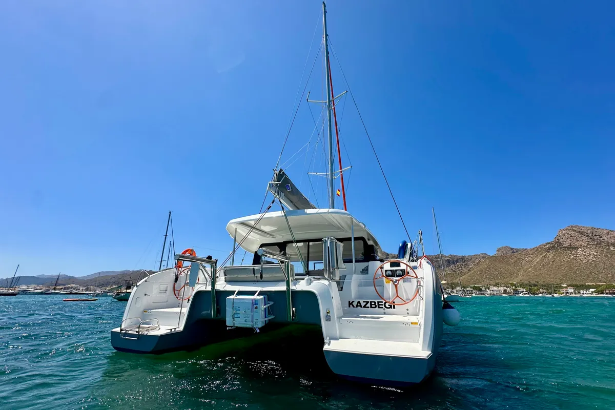 Exterior view of KAZBEGI , a Excess 11 catamaran at Port de Pollença, Spain