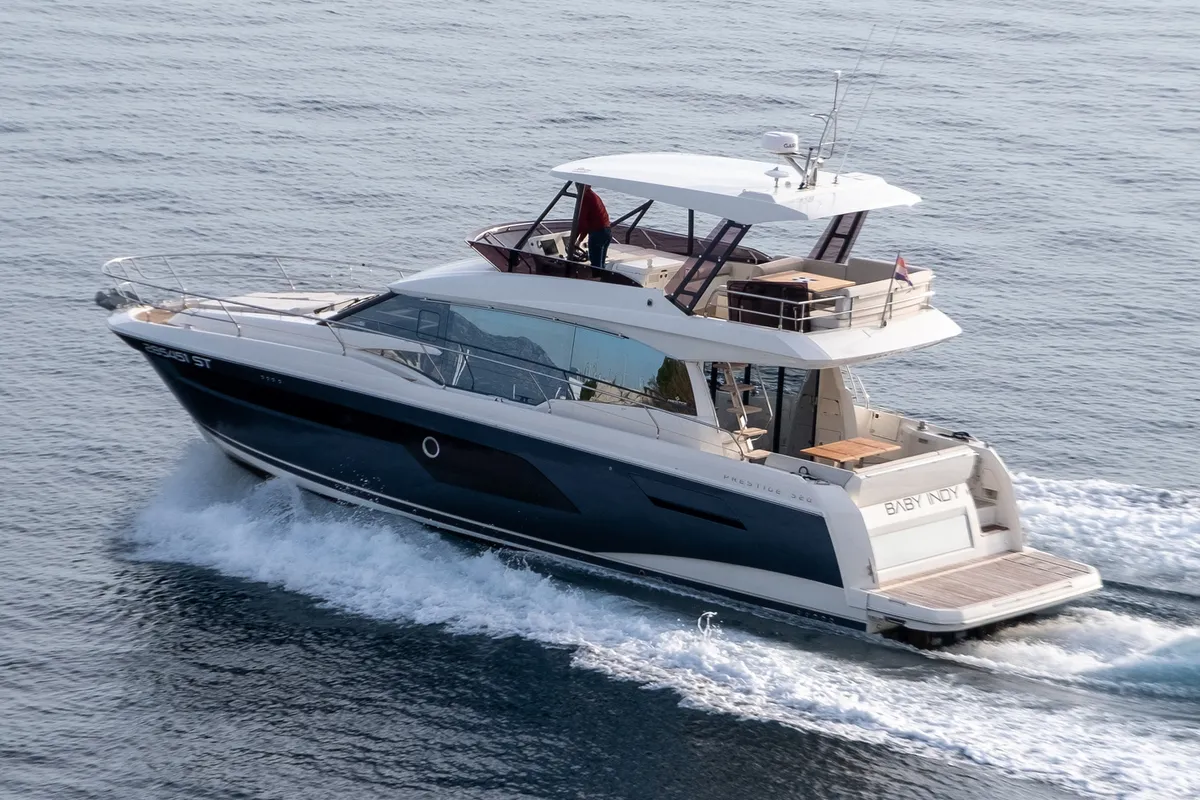 Exterior view of Baby Indy, a Jeanneau Prestige 520 Flybridge motor yacht at Split, Croatia