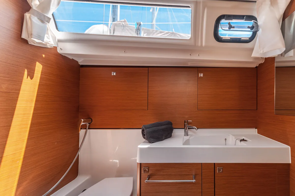Head on Montecarlo, a Jeanneau Sun Odyssey 519 sailboat at Capo d'Orlando, Italy