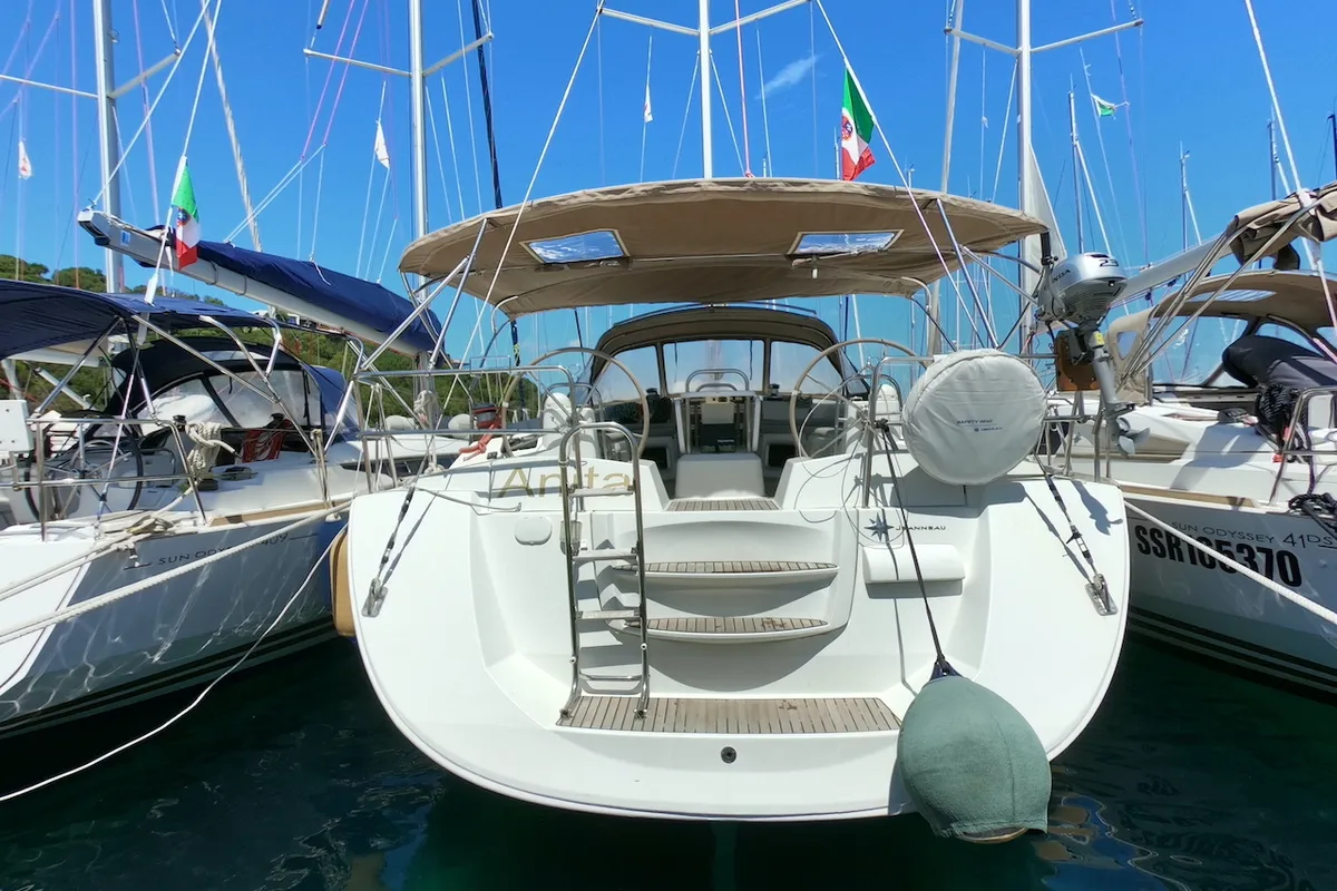 Exterior view of Anita, a Jeanneau 53 sailboat at Olbia, Italy