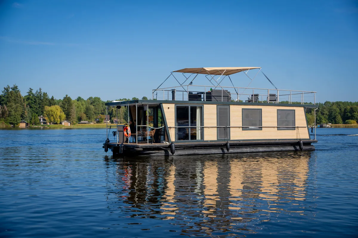Exterior view of Aquila, a Woma D13 motorboat at Fürstenberg/Havel, Germany