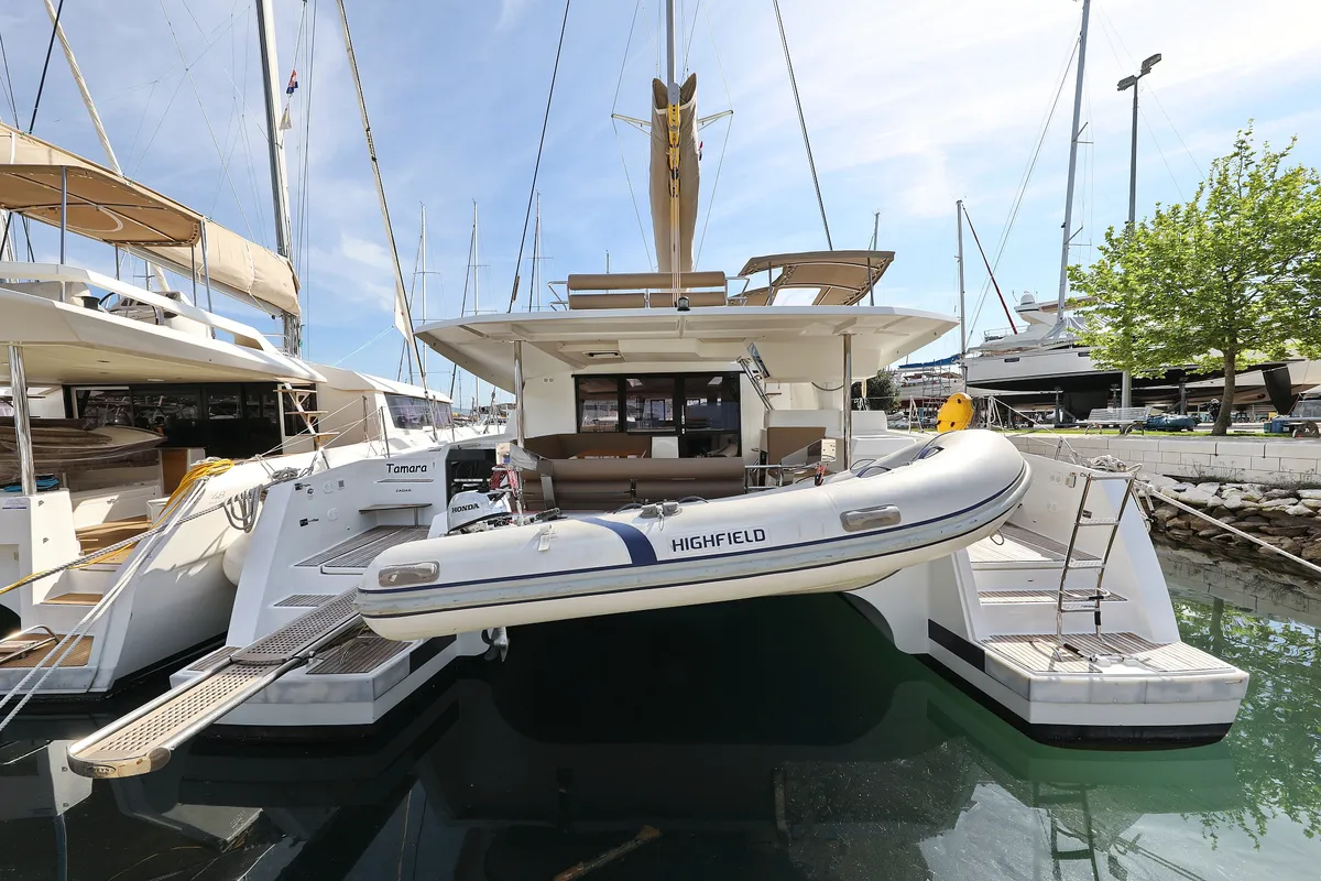 Exterior view of Tamara V, a Fountaine Pajot Saona 47 Quintet catamaran at Grad Trogir, Croatia
