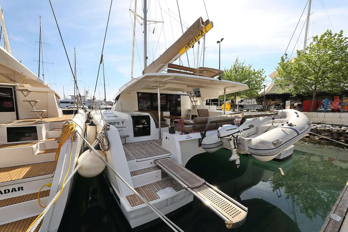 Exterior view of Tamara V, a Fountaine Pajot Saona 47 Quintet catamaran at Grad Trogir, Croatia