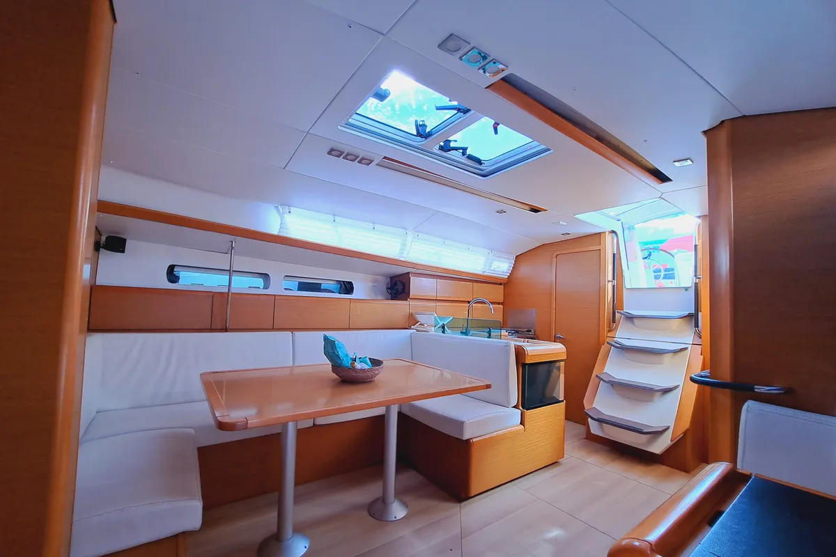 Salon of MIENTRAS TANTO, a Jeanneau Sun Odyssey 449 sailboat at Sant Antoni de Portmany, Spain