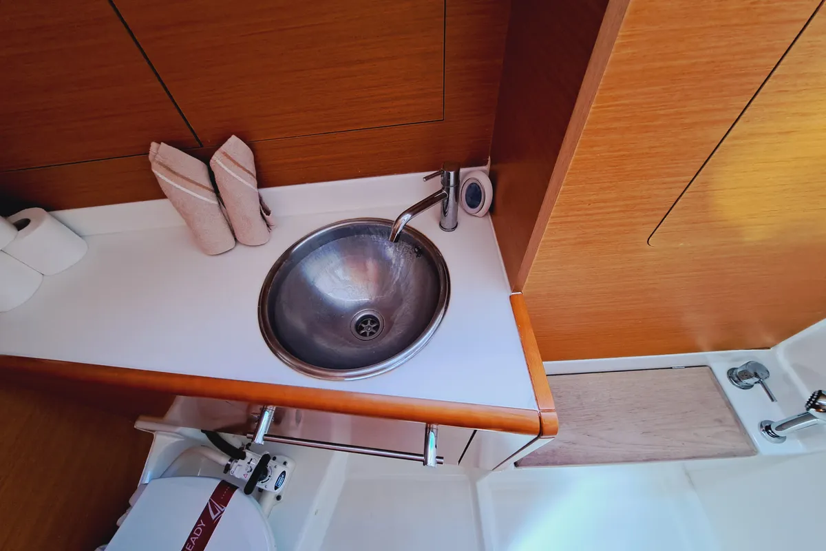 Head on MIENTRAS TANTO, a Jeanneau Sun Odyssey 449 sailboat at Sant Antoni de Portmany, Spain