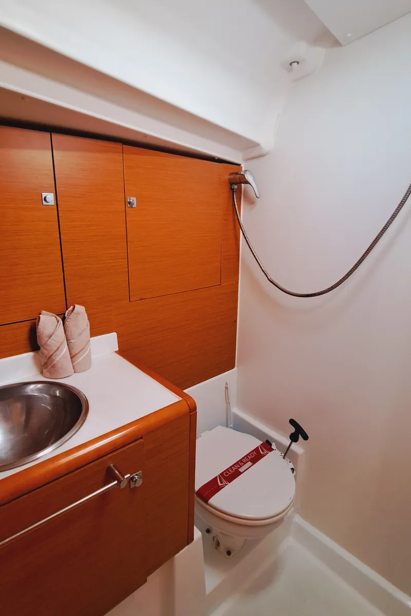 Head on MIENTRAS TANTO, a Jeanneau Sun Odyssey 449 sailboat at Sant Antoni de Portmany, Spain
