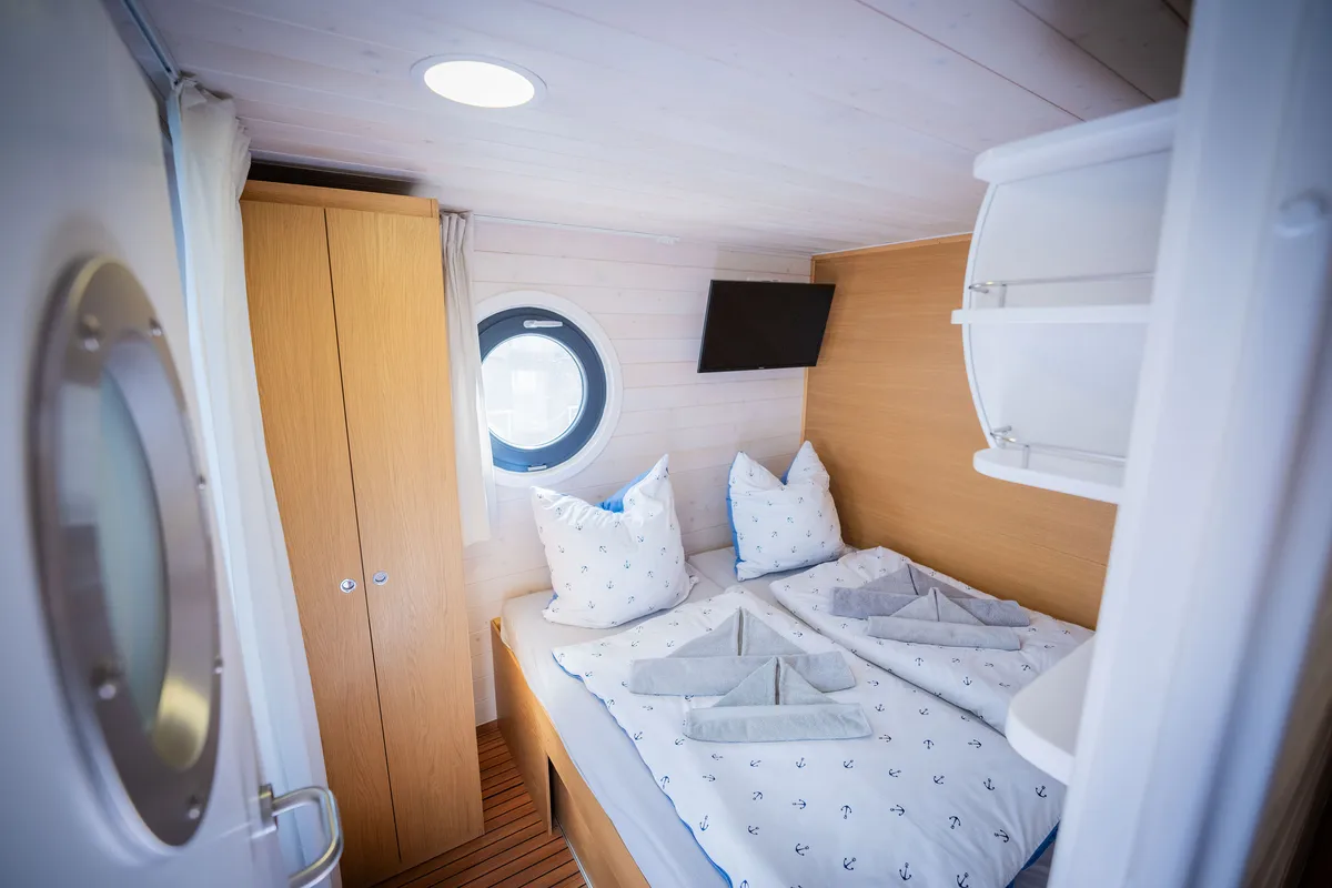 Cabin on RedWine, a Woma D13 motorboat at Fürstenberg/Havel, Germany