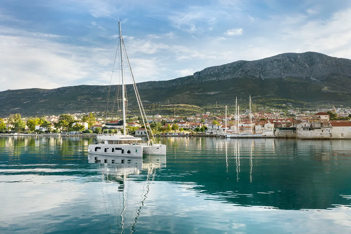 Exterior view of Emerald Gemini, a Lagoon 52 F OW catamaran at Grad Kaštela, Croatia