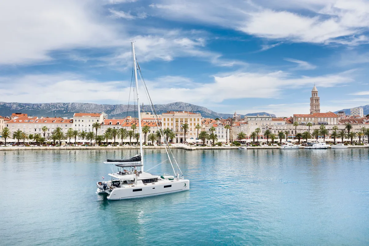 Exterior view of Emerald Gemini, a Lagoon 52 F OW catamaran at Grad Kaštela, Croatia