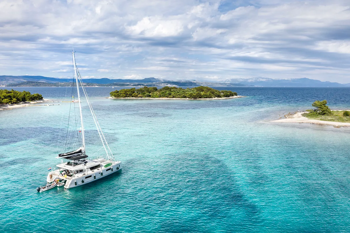 Exterior view of Emerald Gemini, a Lagoon 52 F OW catamaran at Grad Kaštela, Croatia