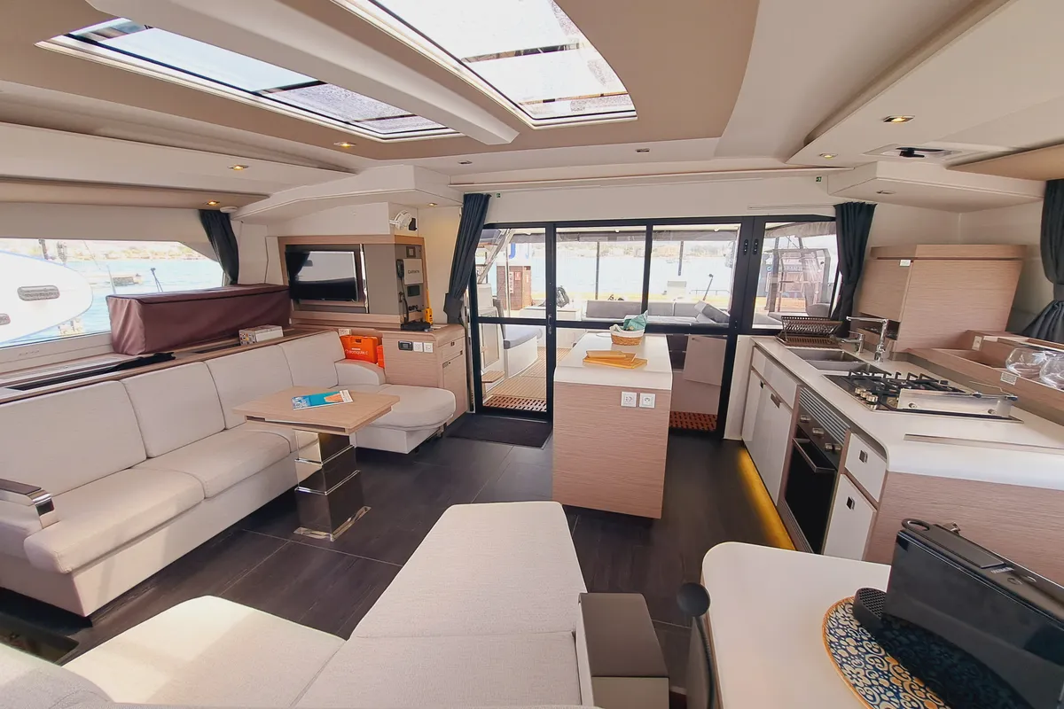 Salon of Le Grand Bogavant, a Fountaine Pajot Aura 51 catamaran at Sant Antoni de Portmany, Spain