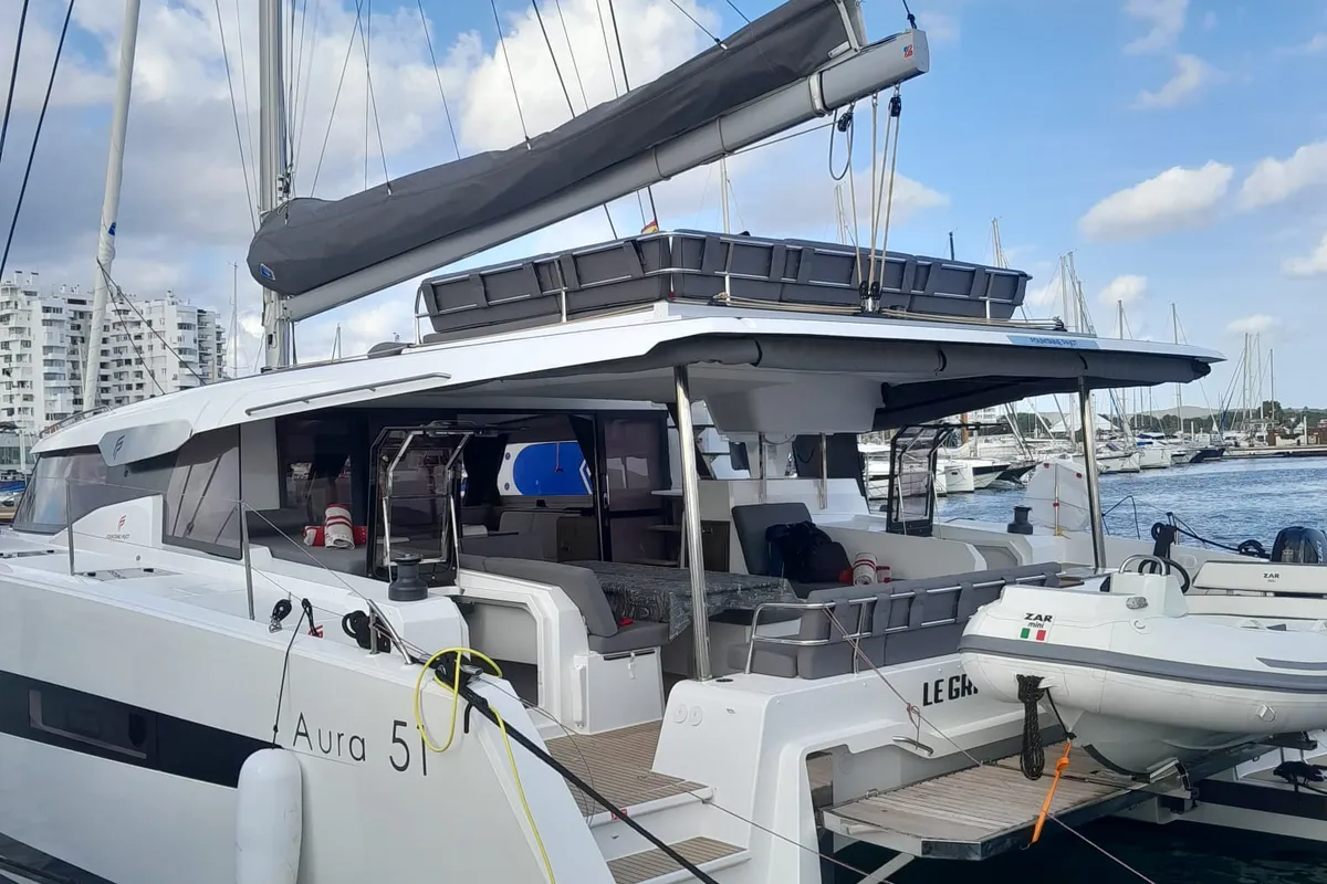 Exterior view of Le Grand Bogavant, a Fountaine Pajot Aura 51 catamaran at Sant Antoni de Portmany, Spain