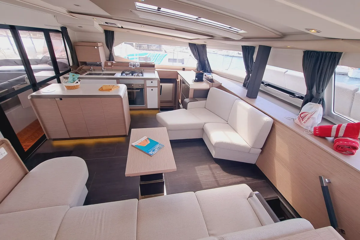 Salon of Le Grand Bogavant, a Fountaine Pajot Aura 51 catamaran at Sant Antoni de Portmany, Spain