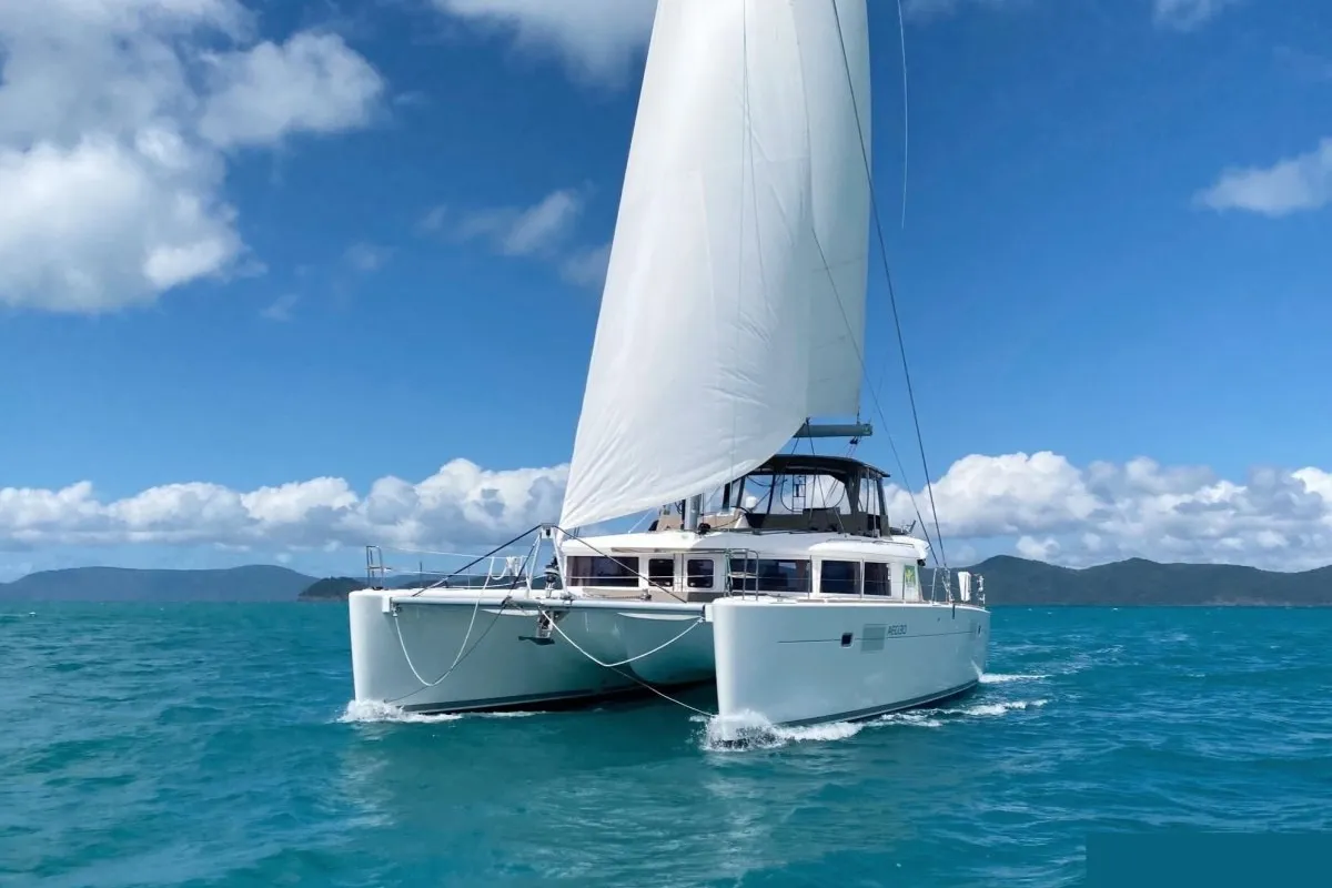 Exterior view of Carmela, a Lagoon 450 Fly catamaran at Sant Antoni de Portmany, Spain