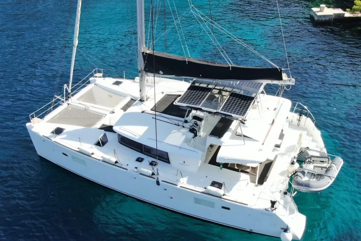 Exterior view of Carmela, a Lagoon 450 Fly catamaran at Sant Antoni de Portmany, Spain