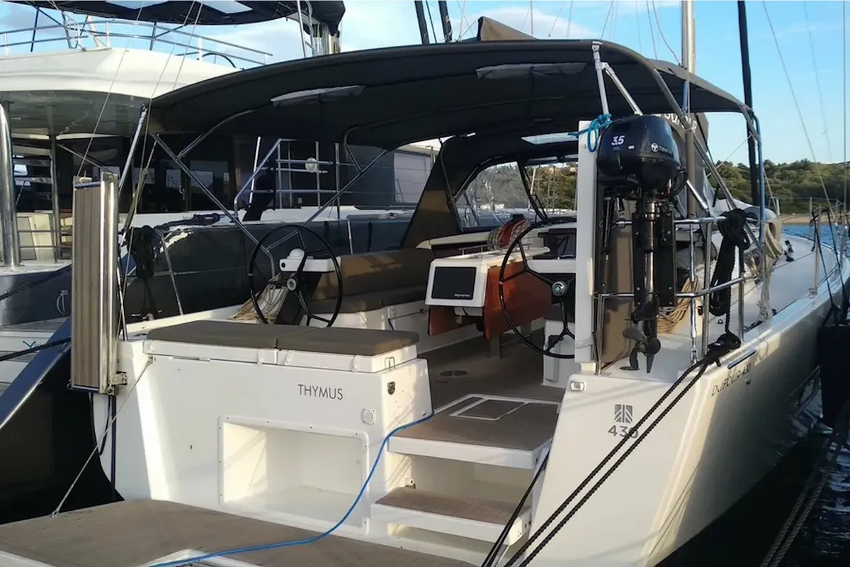 Exterior view of Thymus, a Dufour 430 sailboat at Olbia, Italy
