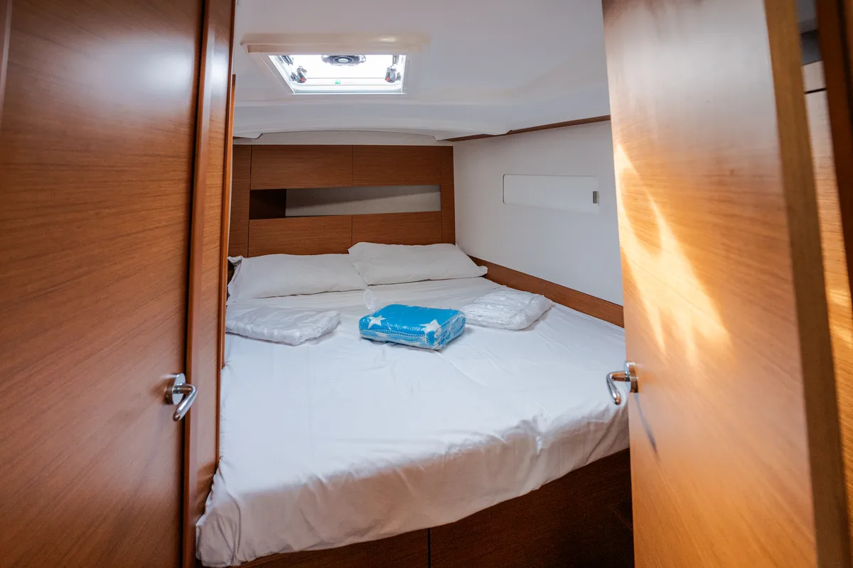 Cabin on Pheia - Comfort line, a Jeanneau Sun Odyssey 410 sailboat at Rosignano Solvay, Italy