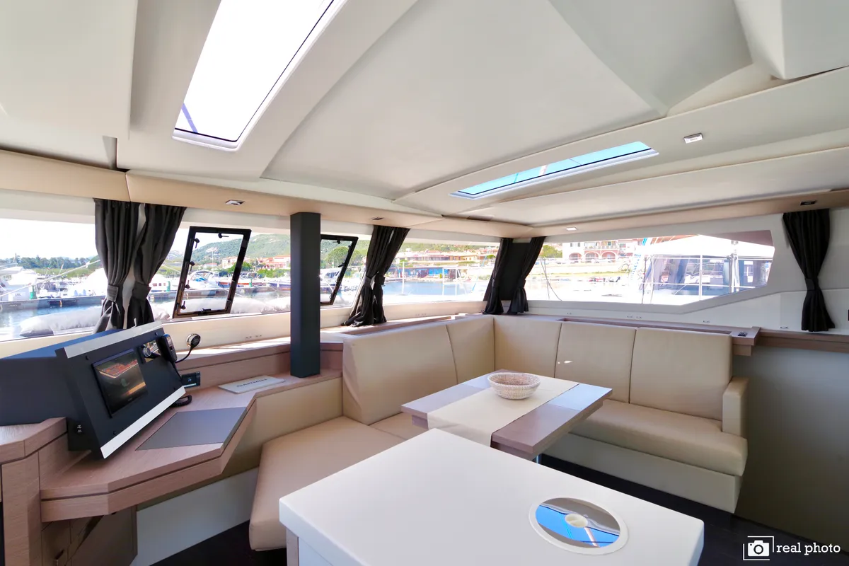 Salon of Orsa 3, a Fountaine Pajot Saona 47 Quintet catamaran at Cannigione, Italy