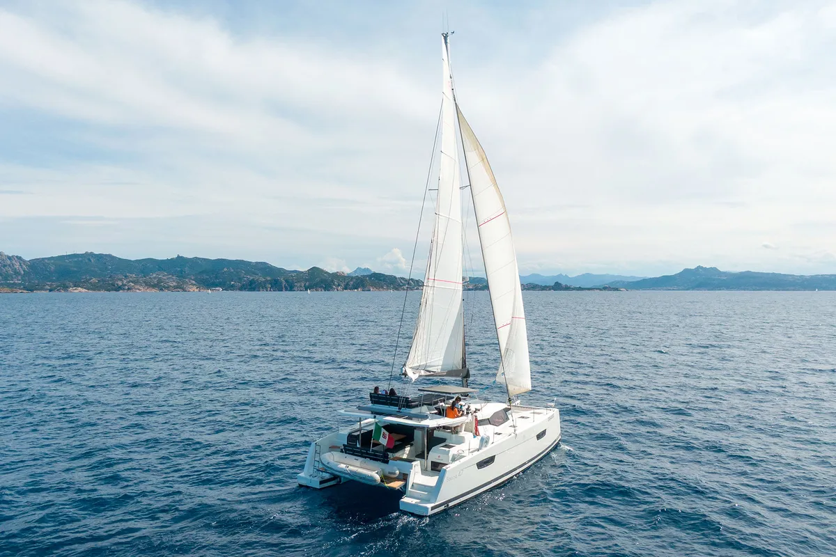 Exterior view of Orsa 3, a Fountaine Pajot Saona 47 Quintet catamaran at Cannigione, Italy