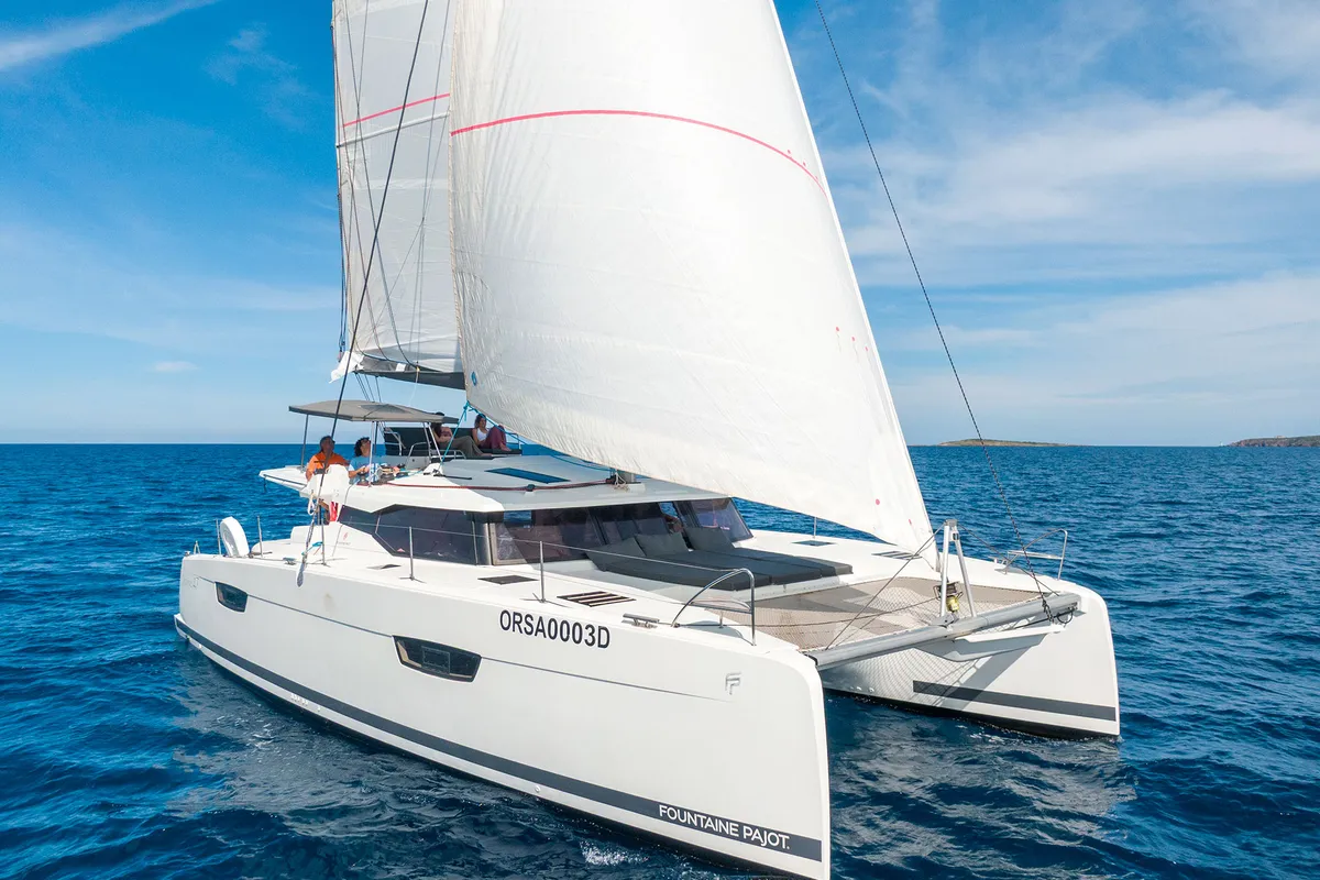 Exterior view of Orsa 3, a Fountaine Pajot Saona 47 Quintet catamaran at Cannigione, Italy