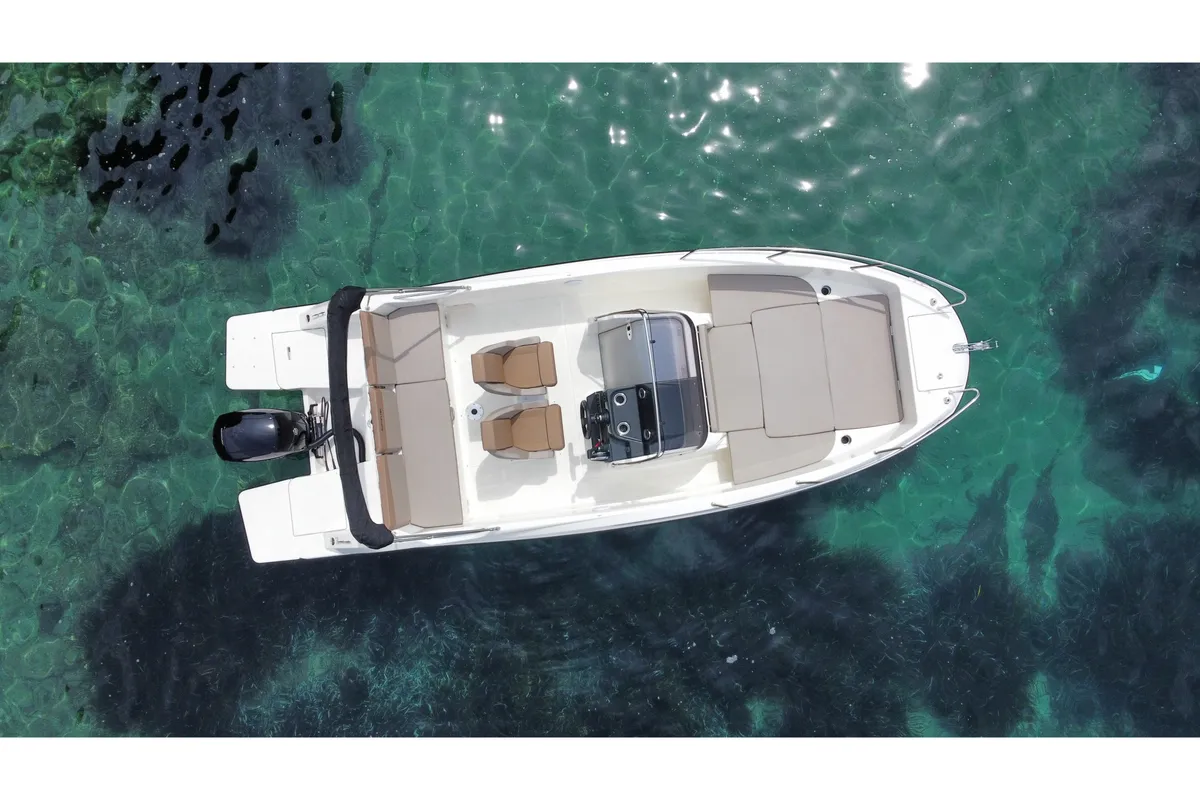 Exterior view of Firulais, a Quicksilver Activ 675 Open motorboat at Roses, Spain