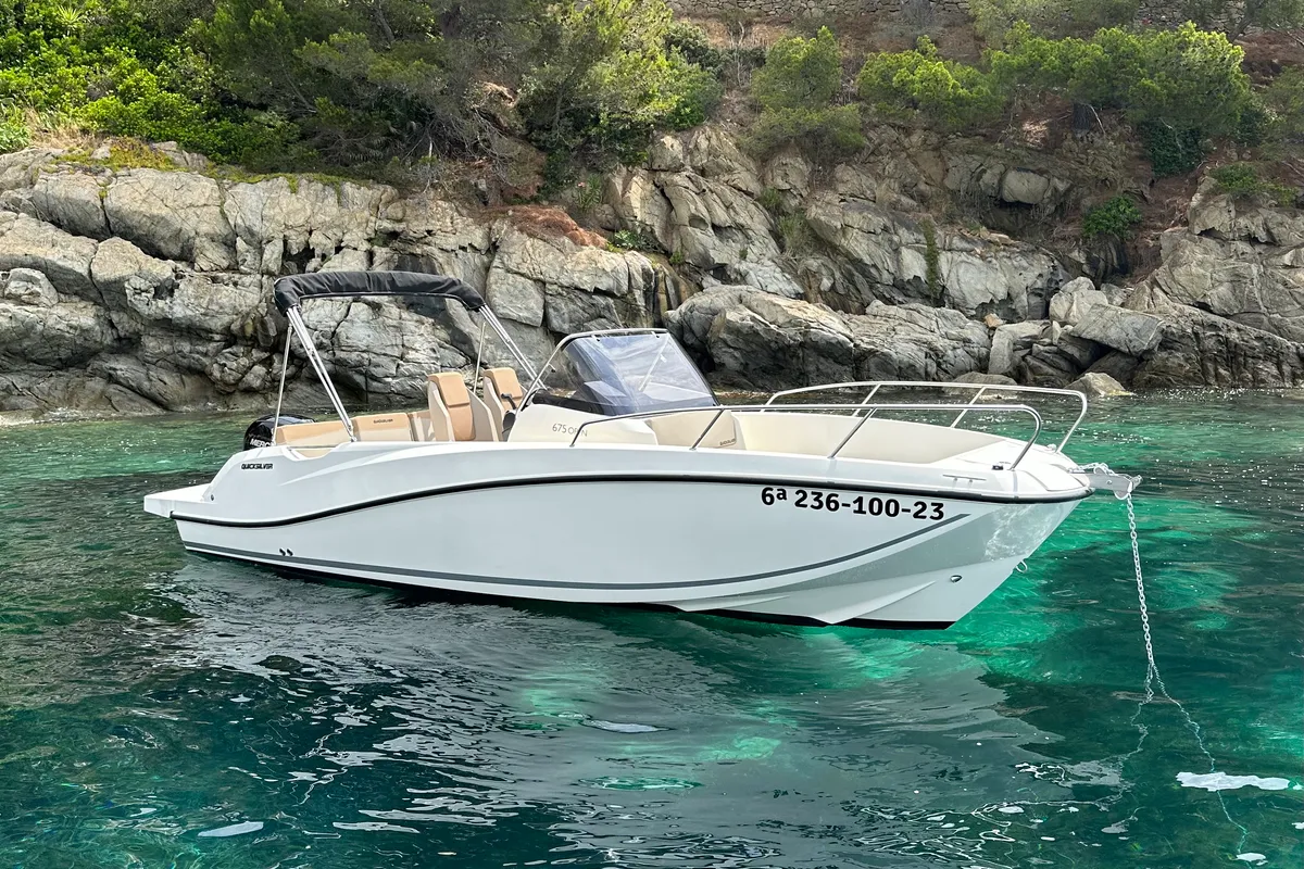 Exterior view of Firulais, a Quicksilver Activ 675 Open motorboat at Roses, Spain