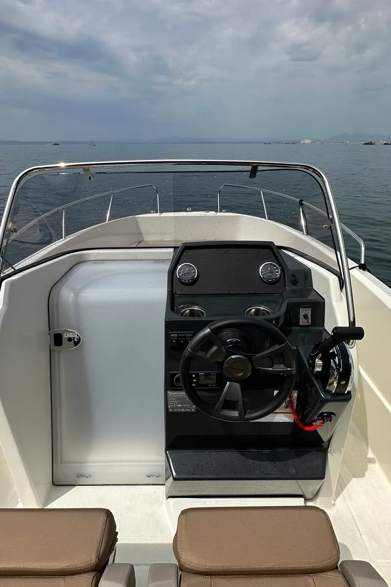 Cockpit of Firulais, a Quicksilver Activ 675 Open motorboat at Roses, Spain