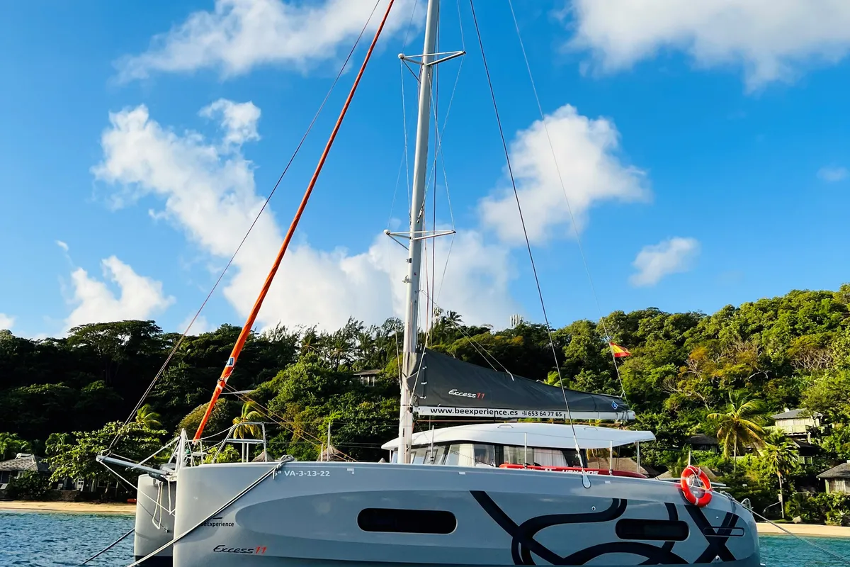 Exterior view of OLOKUM Mallorca BAREBOAT, a Excess 11 catamaran at Port d'Andratx, Spain